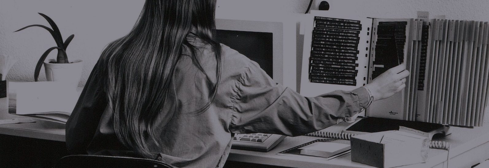 A librarian enters titles in the computer. Saksische Staatsbibliotheek, Dresden. Photograph by Siegfried Bregulla, 1994.